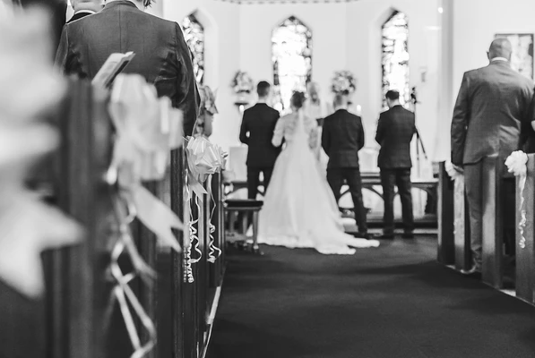 wedding photography by j lawrence bride and groomat alter black and white arty shot